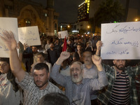 Iranian protesters shout anti-Israeli and anti-U.S. slogans while taking part in a protest gathering to condemn an Israeli air strike agains...