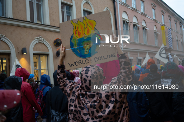 Activists from the environmental group Extinction Rebellion Finland ''Elokapina'' protest in Helsinki, Finland, on September 27, 2024. The g...