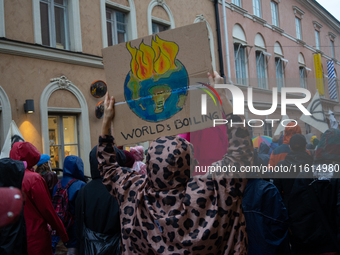 Activists from the environmental group Extinction Rebellion Finland ''Elokapina'' protest in Helsinki, Finland, on September 27, 2024. The g...