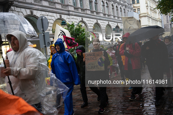 Activists from the environmental group Extinction Rebellion Finland ''Elokapina'' protest in Helsinki, Finland, on September 27, 2024. The g...