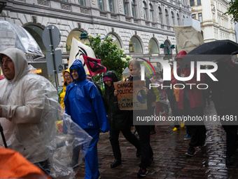 Activists from the environmental group Extinction Rebellion Finland ''Elokapina'' protest in Helsinki, Finland, on September 27, 2024. The g...