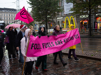 Activists from the environmental group Extinction Rebellion Finland ''Elokapina'' protest in Helsinki, Finland, on September 27, 2024. The g...