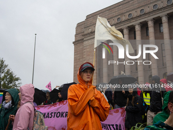 Activists from the environmental group Extinction Rebellion Finland ''Elokapina'' protest in front of the Finnish Parliament in Helsinki, Fi...