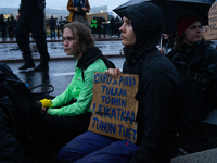 Activists from the environmental group Extinction Rebellion Finland ''Elokapina'' protest in front of the Finnish Parliament in Helsinki, Fi...