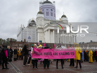 Activists from the environmental group Extinction Rebellion Finland ''Elokapina'' protest in Helsinki, Finland, on September 27, 2024. The g...