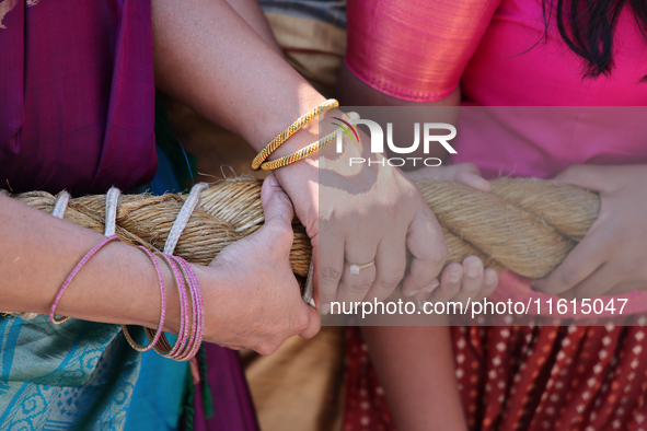 Women pull the chariot as Tamil Hindu devotees take part in the chariot procession (ther) during the Ganesha Mahotshava Vingnapanam Festival...