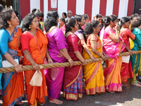 Women pull the chariot as Tamil Hindu devotees take part in the chariot procession (ther) during the Ganesha Mahotshava Vingnapanam Festival...