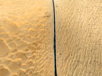 Vehicles drive on a desert highway in Bazhou, Xinjiang province, China, on September 23, 2024. (