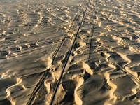 Vehicles drive on a desert highway in Bazhou, Xinjiang province, China, on September 23, 2024. (