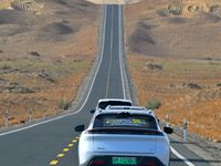 Vehicles drive on a desert highway in Bazhou, Xinjiang province, China, on September 23, 2024. (