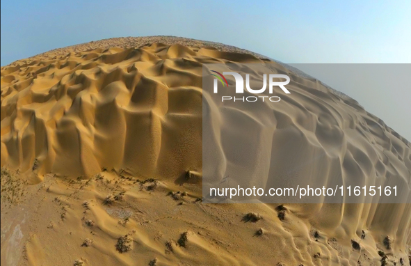 A panoramic view of the ''Whale Sand Mountain'' scenic spot on the desert highway in Bazhou, Xinjiang, China, on September 23, 2024. 