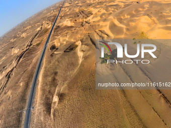 In Bazhou, Xinjiang, China, on September 23, 2024, Desert Highway ''One Tree'' Scenic Spot. (