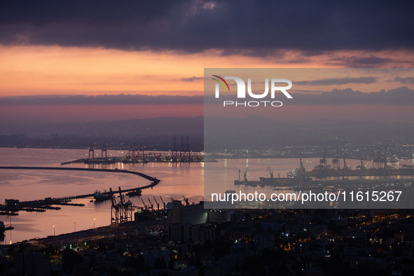 Dawn breaks over the northern Israeli port city of Haifa, in Israel, on September 28, 2024, one day following large-scale Israeli air strike...