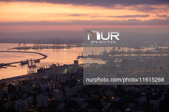 Dawn breaks over the northern Israeli port city of Haifa, in Israel, on September 28, 2024, one day following large-scale Israeli air strike...