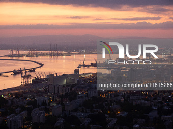 Dawn breaks over the northern Israeli port city of Haifa, in Israel, on September 28, 2024, one day following large-scale Israeli air strike...