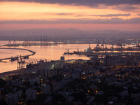 Dawn breaks over the northern Israeli port city of Haifa, in Israel, on September 28, 2024, one day following large-scale Israeli air strike...