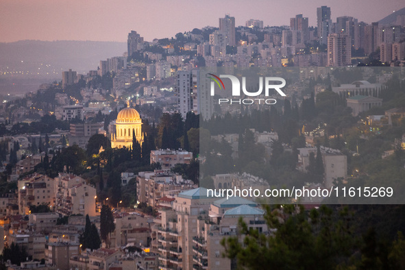 Dawn breaks over the northern Israeli port city of Haifa, in Israel, on September 28, 2024, one day following large-scale Israeli air strike...