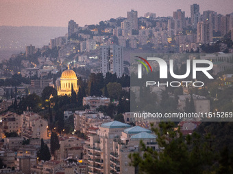 Dawn breaks over the northern Israeli port city of Haifa, in Israel, on September 28, 2024, one day following large-scale Israeli air strike...