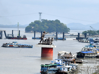 People ride in a ferry on the Brahmaputra River in Guwahati, India, on September 28, 2024. (