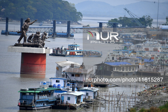 People ride in a ferry on the Brahmaputra River in Guwahati, India, on September 28, 2024. 