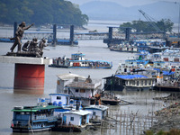 People ride in a ferry on the Brahmaputra River in Guwahati, India, on September 28, 2024. (