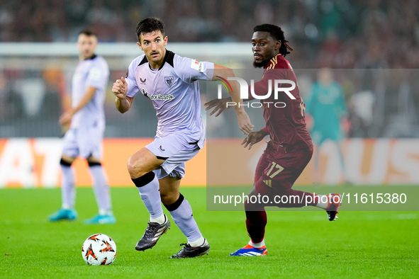 Daniel Vivian of Athletic Club and Manu Kone' of AS Roma compete for the ball during the UEFA Europa League 2024/25 League Phase MD1 match b...