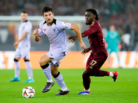 Daniel Vivian of Athletic Club and Manu Kone' of AS Roma compete for the ball during the UEFA Europa League 2024/25 League Phase MD1 match b...