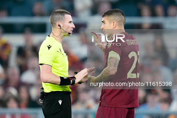 Gianluca Mancini of AS Roma talks to referee Georgi Kabakov during the UEFA Europa League 2024/25 League Phase MD1 match between AS Roma and...