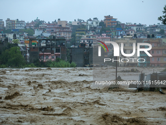 The swollen Nakkhu River inundates infrastructures built on its embankments in Lalitpur, Nepal, on September 28, 2024. At least 32 people di...