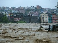 The swollen Nakkhu River inundates infrastructures built on its embankments in Lalitpur, Nepal, on September 28, 2024. At least 32 people di...