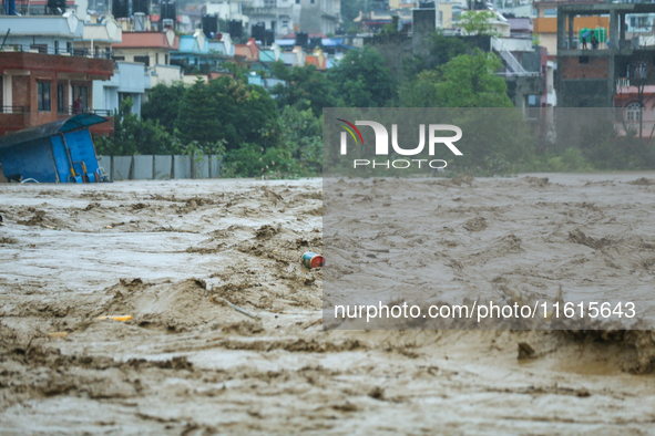 The swollen Nakkhu River inundates infrastructures built on its embankments in Lalitpur, Nepal, on September 28, 2024. At least 32 people di...