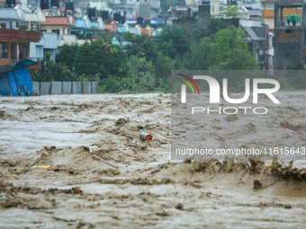 The swollen Nakkhu River inundates infrastructures built on its embankments in Lalitpur, Nepal, on September 28, 2024. At least 32 people di...