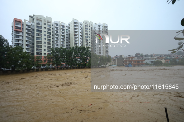 The swollen Nakkhu River inundates infrastructures built on its embankments in Lalitpur, Nepal, on September 28, 2024. At least 32 people di...