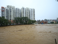 The swollen Nakkhu River inundates infrastructures built on its embankments in Lalitpur, Nepal, on September 28, 2024. At least 32 people di...