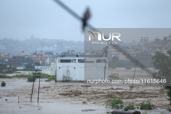 The swollen Nakkhu River inundates infrastructures built on its embankments in Lalitpur, Nepal, on September 28, 2024. At least 32 people di...