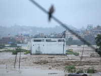 The swollen Nakkhu River inundates infrastructures built on its embankments in Lalitpur, Nepal, on September 28, 2024. At least 32 people di...