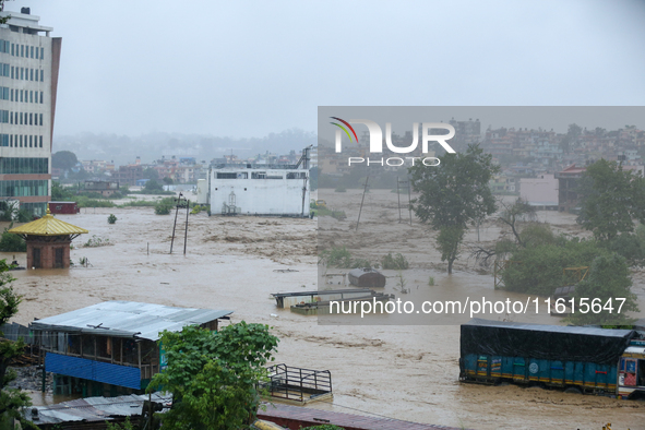 The swollen Nakkhu River inundates infrastructures built on its embankments in Lalitpur, Nepal, on September 28, 2024. At least 32 people di...