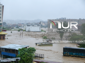 The swollen Nakkhu River inundates infrastructures built on its embankments in Lalitpur, Nepal, on September 28, 2024. At least 32 people di...