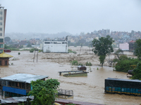 The swollen Nakkhu River inundates infrastructures built on its embankments in Lalitpur, Nepal, on September 28, 2024. At least 32 people di...