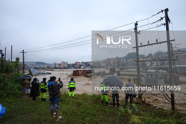 Security personnel of Nepal's security agencies carry out the rescue operation in Lalitpur, Nepal, on September 28, 2024. At least 32 people...