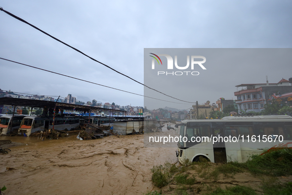 Nepal's Armed Police Force rescues stranded people using a zipline rescue method from a flooded river in Lalitpur, Nepal, on September 28, 2...