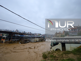 Nepal's Armed Police Force rescues stranded people using a zipline rescue method from a flooded river in Lalitpur, Nepal, on September 28, 2...