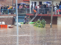 The Nepal Army conducts a rescue operation after a house is inundated by the swollen Bagmati River in Kathmandu, Nepal, on September 28, 202...