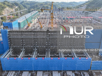 Construction workers work at the construction site of the 800 kV Yubei converter station in Chongqing, China, on September 28, 2024. (