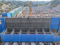 Construction workers work at the construction site of the 800 kV Yubei converter station in Chongqing, China, on September 28, 2024. (