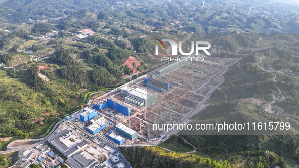 Construction workers work at the construction site of the 800 kV Yubei converter station in Chongqing, China, on September 28, 2024. 