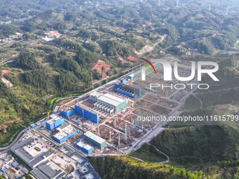 Construction workers work at the construction site of the 800 kV Yubei converter station in Chongqing, China, on September 28, 2024. (