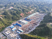 Construction workers work at the construction site of the 800 kV Yubei converter station in Chongqing, China, on September 28, 2024. (