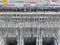 Construction workers work at the construction site of the 800 kV Yubei converter station in Chongqing, China, on September 28, 2024. (