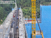 Construction workers work at the construction site of the 800 kV Yubei converter station in Chongqing, China, on September 28, 2024. (